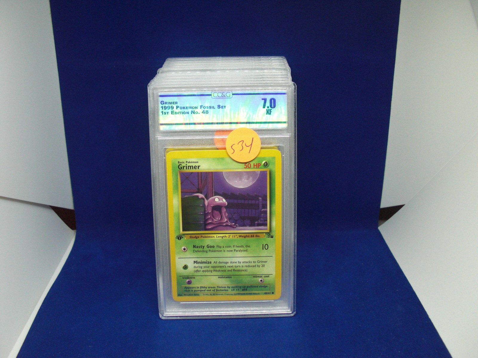 csg graded pokemon mint 7 grimer 1st edition: nice graded card