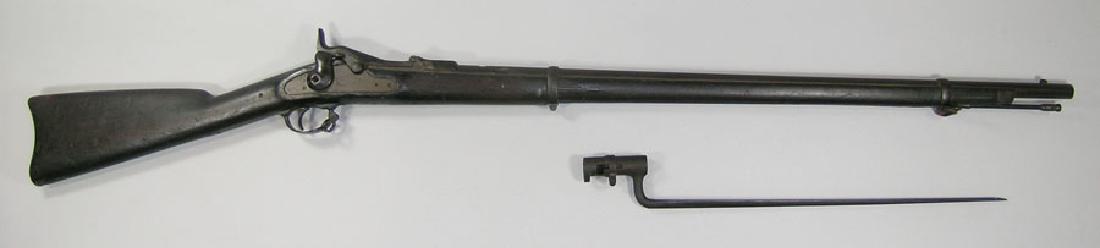 U.S. Springfield Model 1870 Trapdoor Rifle: U.S. Springfield Model 1870 Trapdoor Rifle .45-70 cal., 33" barrel. Condition: Overall oxidation with minor pitting, missing rear site.