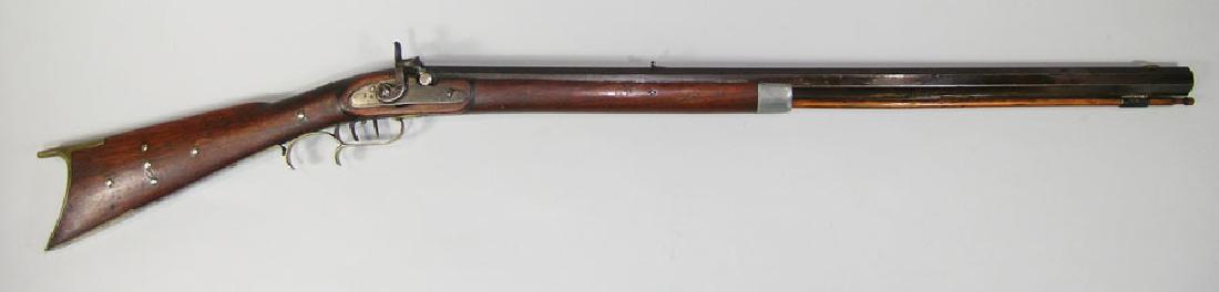 19th C. Percussion Long Rifle: 19th C. Percussion Long Rifle .36 cal., lock marked Conestoga, double set triggers, half stock with thin cheek piece, brass tack decoration and pewter cap, 31" octagon barrel. Condition: 60-70%