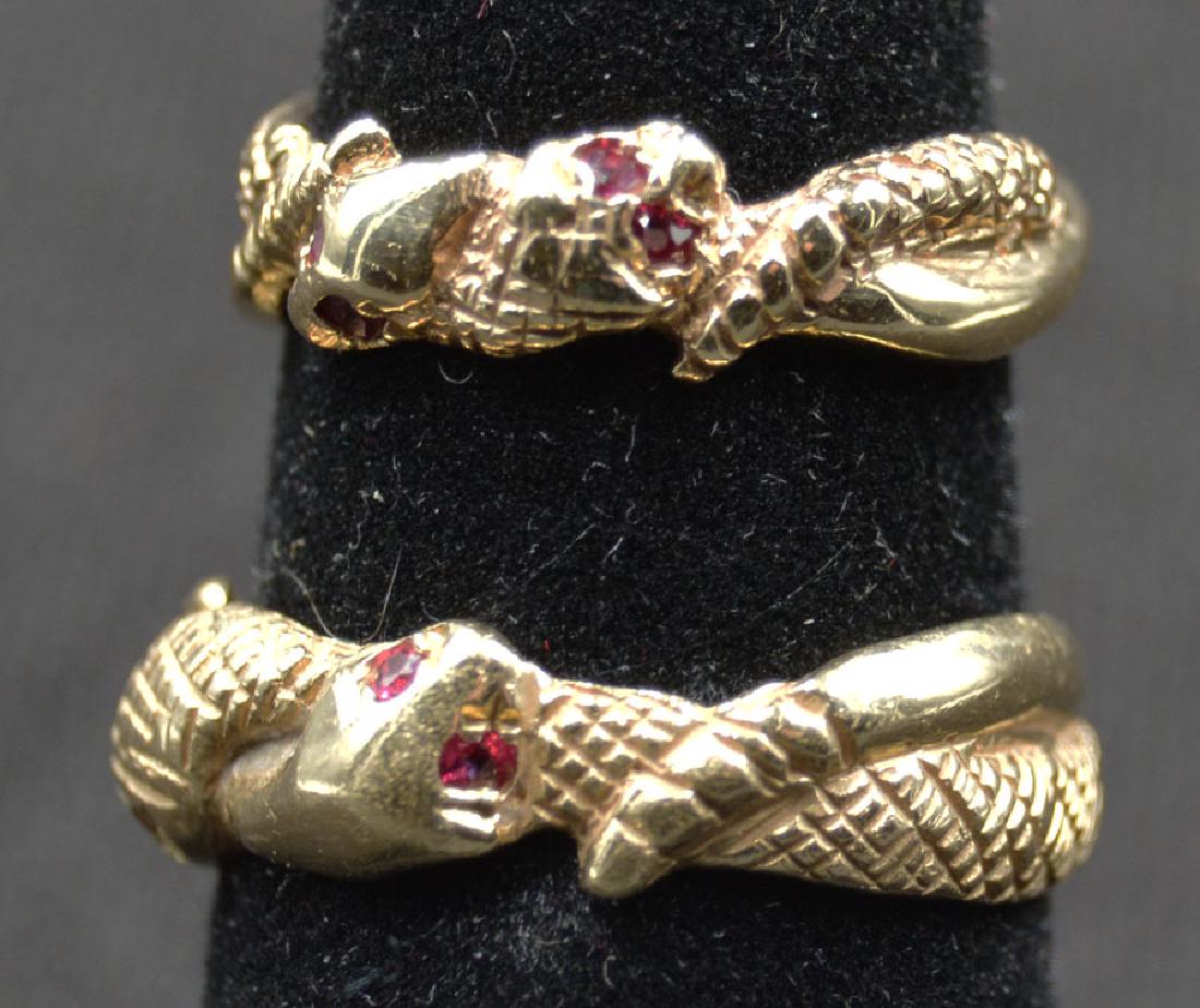 Pair of 14k Intertwined Snakes Wedding Bands: The snake eyes being small rubies; man's size 7 1/4, ladies size 4 3/4; 8g total weight