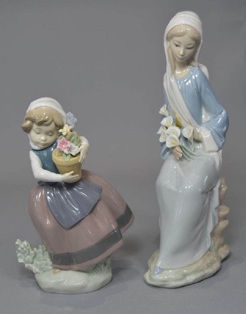Two Lladro Girl Figurines: #4650 Girl with Calla Lillies, 9 1/4" high and #5223 "Spring Is Here", 6 3/4" high.