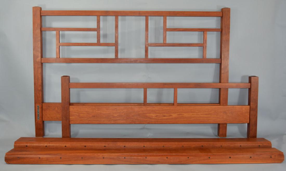 Thomas Moser New Century China Bed: Circa 2000, Cherry, queen size. This lot is accompanied by a Thos. Moser catalog showing the bed, along with the hardcover book "Thos. Moser Artistry In Wood" signed by Thos. Moser to the consignor. P