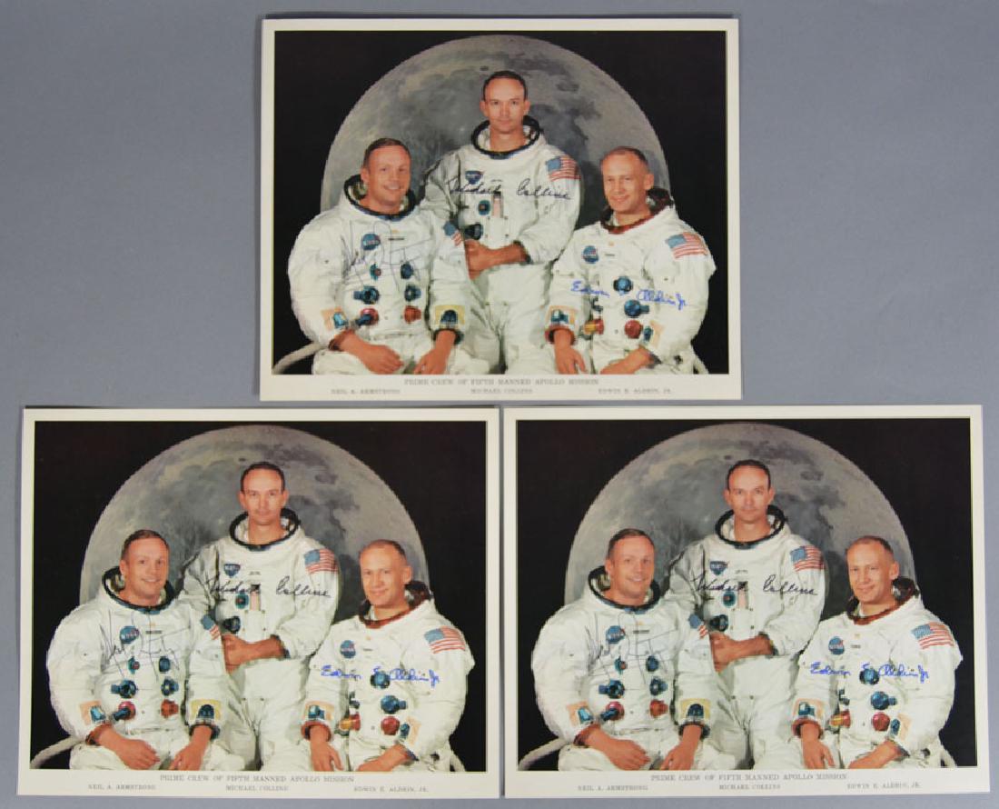 Three Apollo Astronaut Color Photographs: Depicting the Fifth Manned Apollo Crew being Neil A. Armstrong, Michael Collins and Edwin E. Aldrin, Jr. with a backdrop of the moon, 8" x 10", autographed but may be autopen. Provenance: Collection o