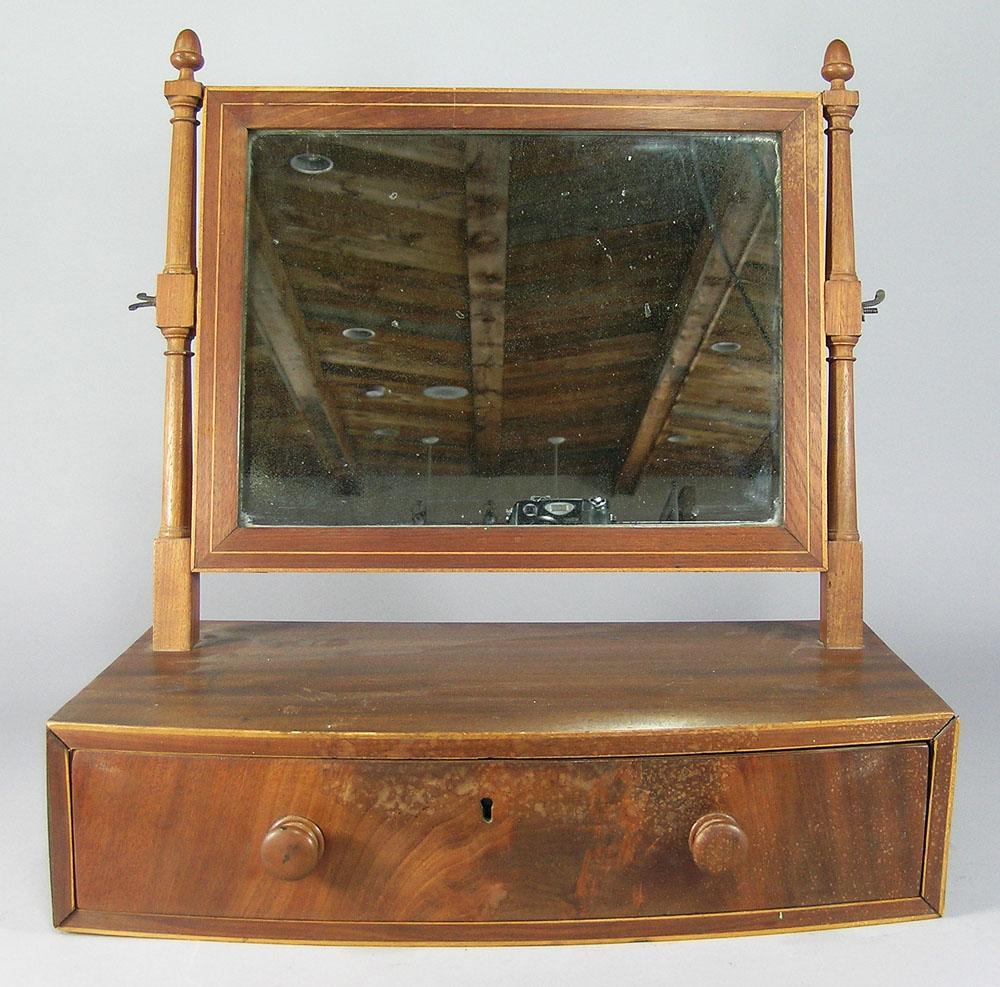 Antique Sheraton One-Drawer Shaving Mirror: mahogany, having what appears to be the original rectangular mirror, flanked by turn decorated mirror supports with acorn finials, over a rectangular bow front case having a single finely hand dovetai