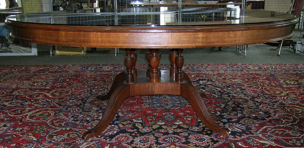 Mahogany Duncan Phyfe Style Conference Table: round bookmatched veneer top, with glass cover, turn decorated supports, raised on flaring legs, 78" dia., 30" H.