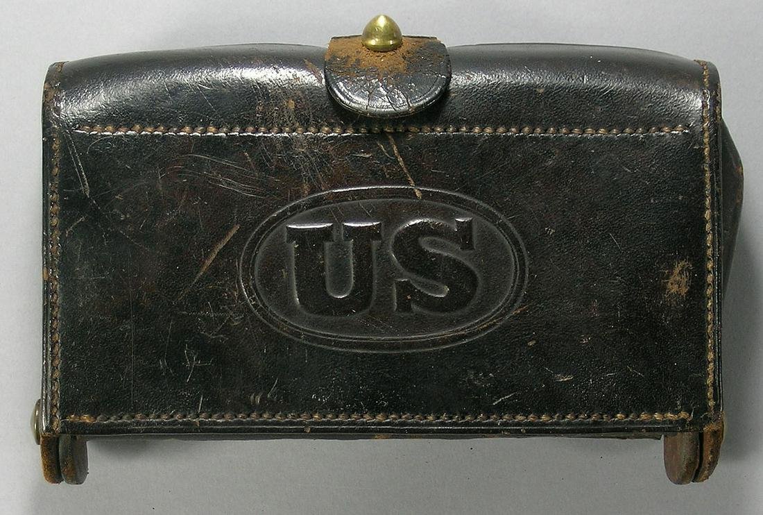 U.S. Military McKeever Leather Cartridge Box: stamped Watervliet Arsenal, late 19th/Early 20th C., including 18 .30 caliber cartridges which appear to be original to the box , 4" x 6 1/2"