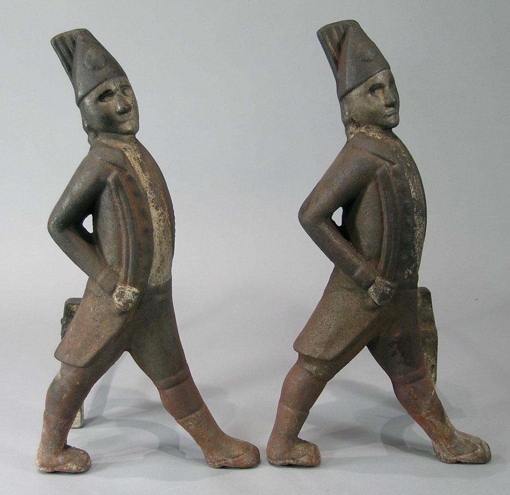 Pair of Antique Hessian Soldier Cast Iron Andirons: facing right, has remains of what appears to be original paint, each being 16" high.