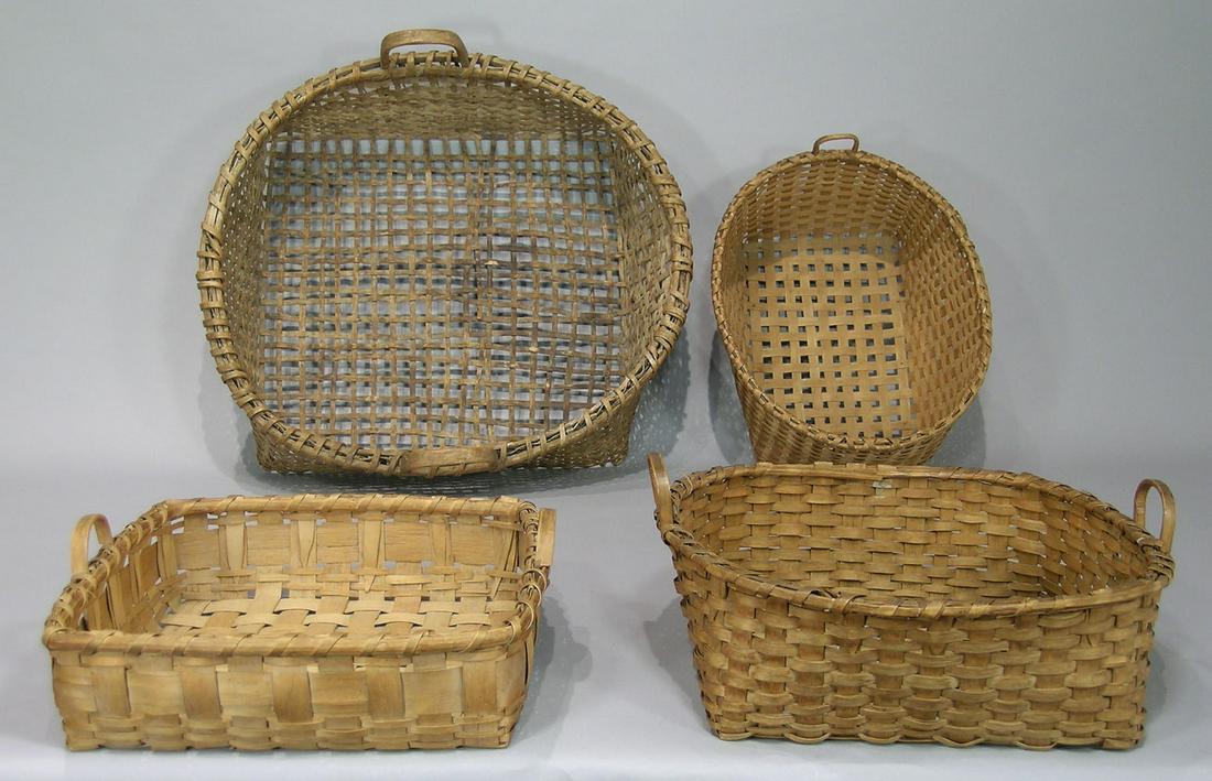 Four Antique Gathering Baskets: New England, two possibly being Shaker, three having single wrapped rims, the largest being 18 1/2" x 20" x 5 1/4" deep.