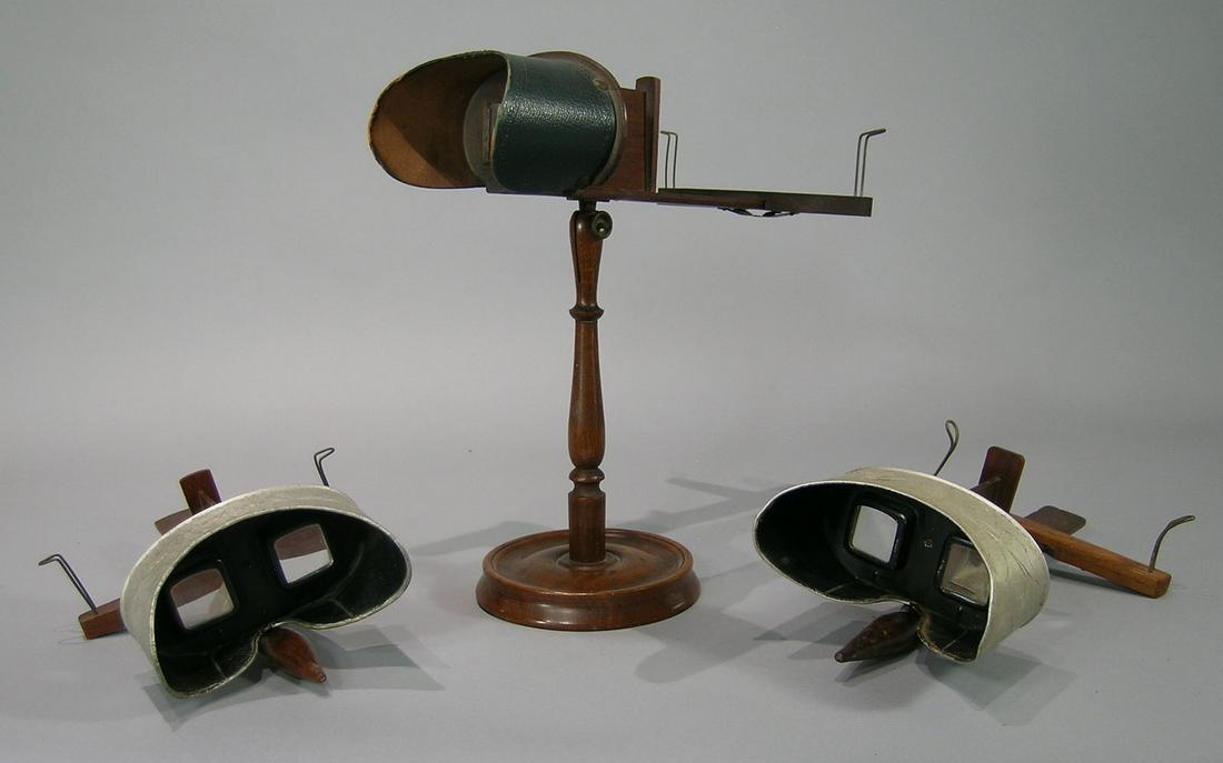 Three 19th C. Stereoscope Viewers: one table top on walnut pedestal by American Lens Stereo Scope, 12 1/2" H., and two hand held by Underwood & Underwood