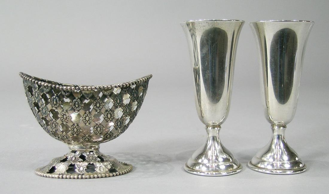 Three Sterling Silver Table Articles: comprising a pair of Randahl Cordials, 3" high, and an open basket weave master salt holder, 2 5/8" L., approx. 2.65 troy ozs. total