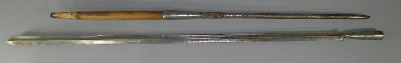 African Masai Warrior Lion Spear: hand forged iron blade, 35 1/2" L, wooden central section and having a hand forged round iron handle with notched decoration, 71" L. overall. Provenance: From a Private Collector in Illinois who acqui