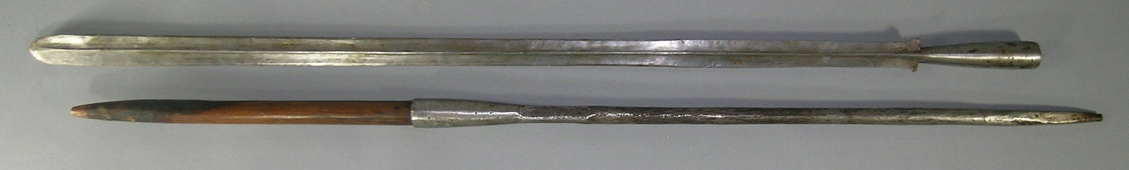 African Masai Warrior Lion Spear: hand forged iron blade, 32" L, wooden central section and having a hand forged round iron handle tapering to square, 70" L. overall. Provenance: From a Private Collector in Illinois who acquired the i