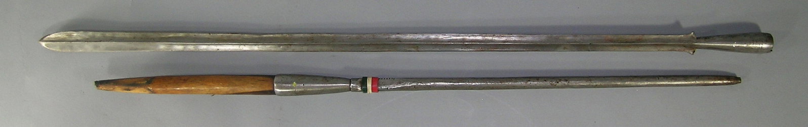 African Masai Warrior Lion Spear: hand forged iron blade, 34 1/2" L, wooden central section and having a hand forged round iron handle with three bands of color decoration with notch marks, 69 1/4" L. overall. Provenance: From a Priva