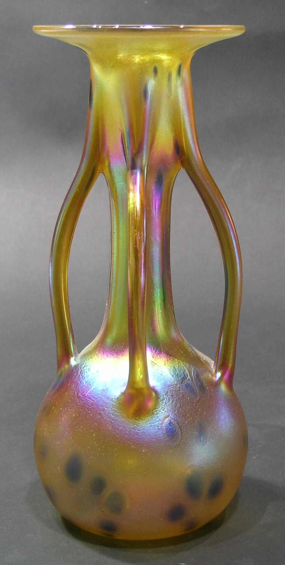CONTEMPORARY ART GLASS VASE: Favrille flash on the outside, and having four branches on the sides, 9 3/4" high