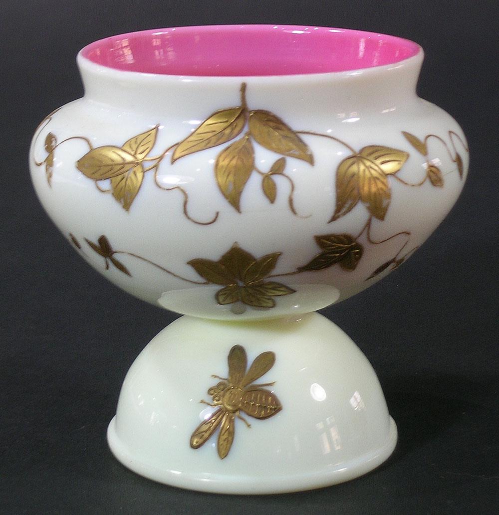 VICTORIAN CASED GLASS FOOTED DISH: white over pink and having gilt vine, bee and butterfly decoration, 3 3/4" high
