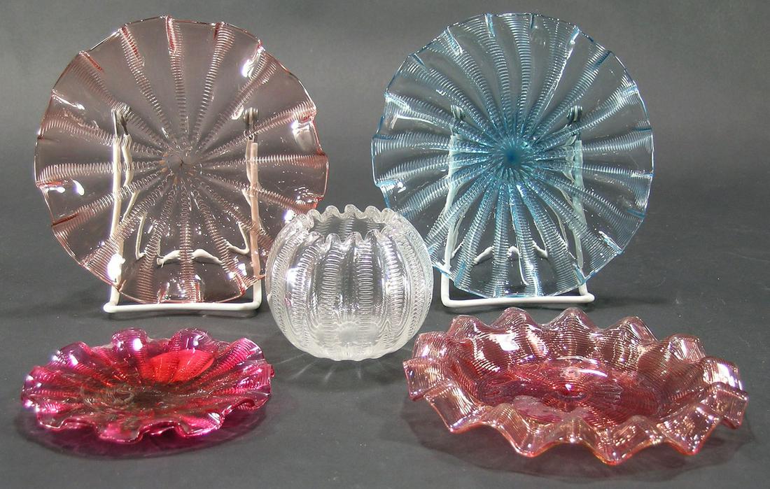 FIVE STEVENS & WILLIAMS ZIPPER PATTERN TABLE ARTICLES: comprising a pink underplate, 6 1/2" dia., 2-small plates in blue and pink, 6 3/4" dia., a small cranberry plate, 4 1/2'" dia., and being from the Estate Of Gladys Hasty Carroll, and a clear glass ros