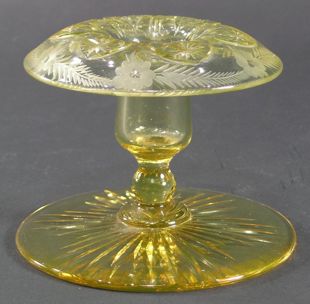 PAIRPOINT CUT GLASS CANDLESTICK: amber glass, central floral decoration, fern and floral border, 4 3/4" dia., 3 3/4" high