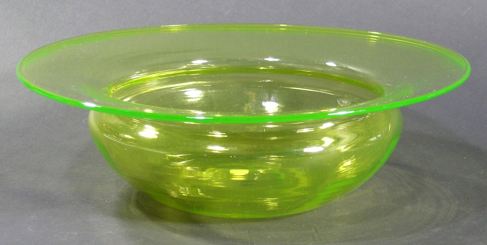 LARGE PAIRPOINT ART GLASS BOWL: Canaria/Vaseline, 12" dia., 3 3/4" high, having the original round paper label on underside