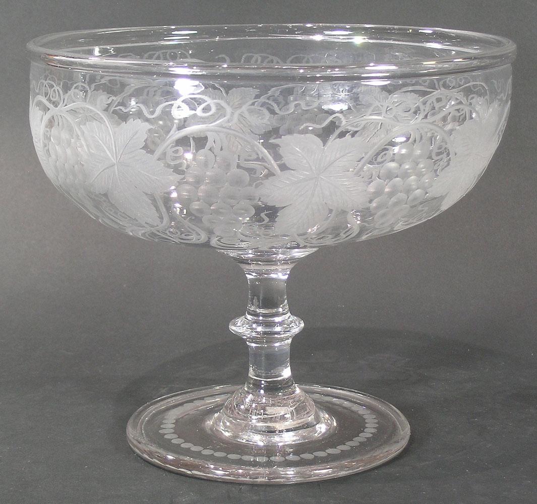 GUNDERSEN PAIRPOINT CUT GLASS FOOTED FRUIT BOWL: Grapevine design, 9" dia., 8" high, having a Gundersen Masterpiece label affixed to the underside of the base