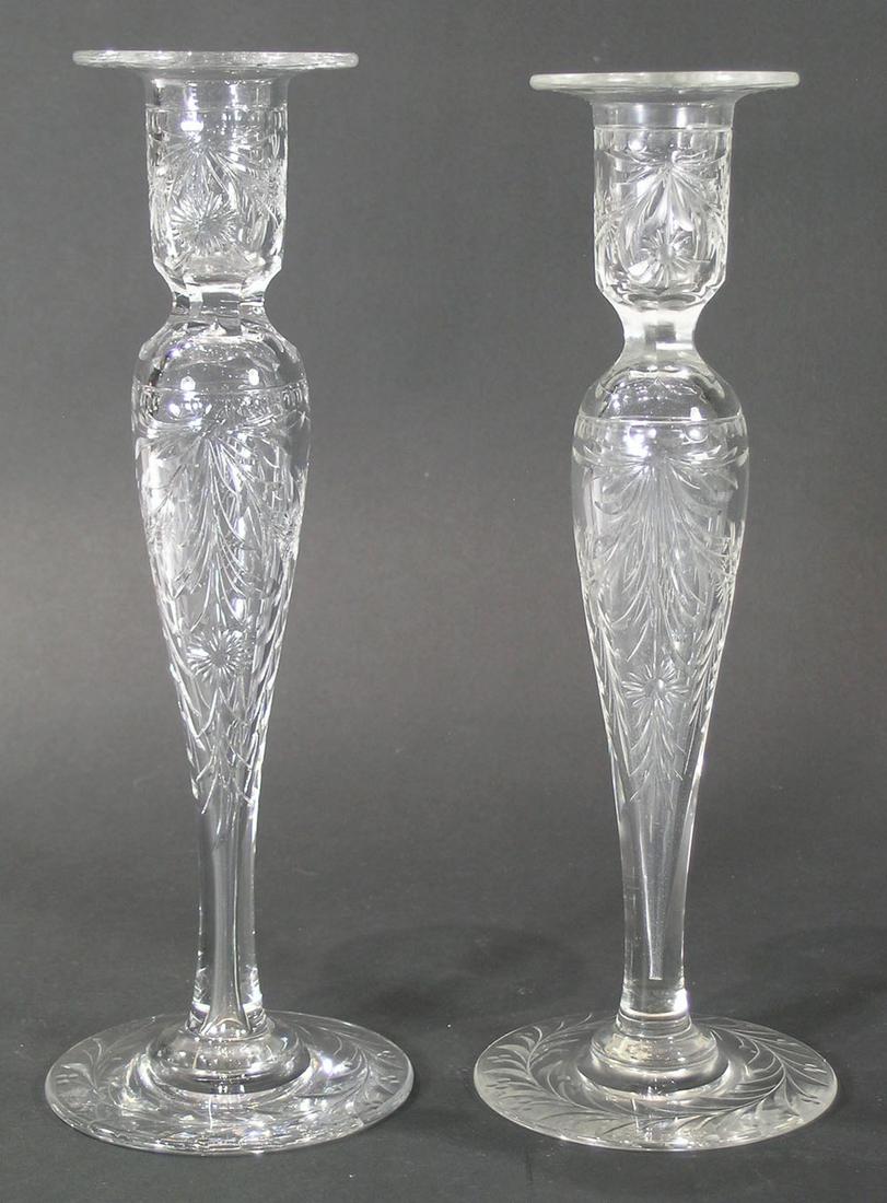 TWO PAIRS OF GUNDERSEN PAIRPOINT CUT GLASS CANDLESTICKS: #1600, Hempstead design, 11" high, and # Unknown 15 floral and leaf etched design, 3 3/4" high. Three of the four having Gundersen Masterpiece labels affixed to the underside of the bases