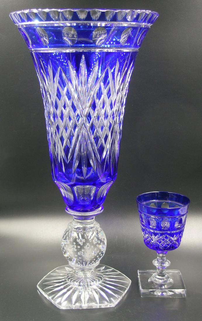 PAIRPOINT #B-1485 CUT GLASS VASE AND WINE GLASS: both cobalt blue cut to clear and being in the Lincoln pattern, vase has a controlled bubble ball knop, hex base, 6 1/2" dia., 13" high, wine glass on a square base, 4 1/2" high