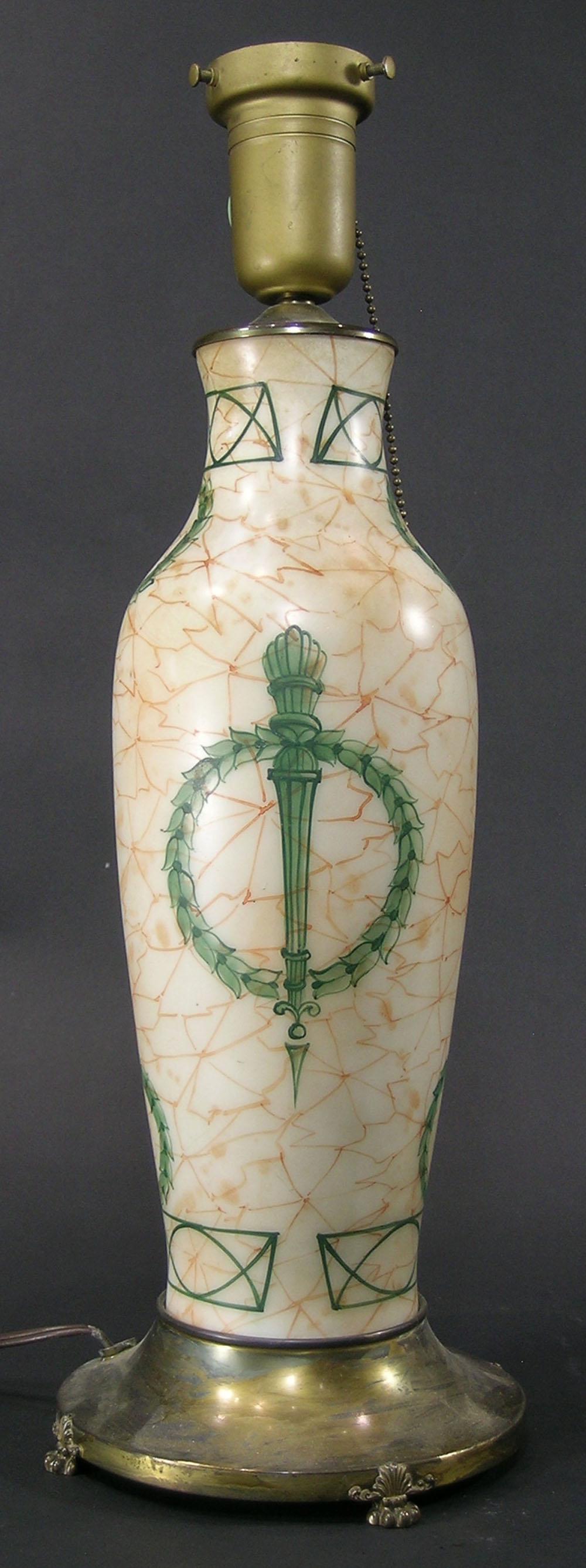 PAIRPOINT ART GLASS HAND PAINTED TABLE LAAMP: marbleized with an Olympic torch in a Laurel Wreath decoration, on a brass base with paw feet, base signed Pairpoint and the numbers G30 C9, 16" high to top of base, 19 3/4" high overall