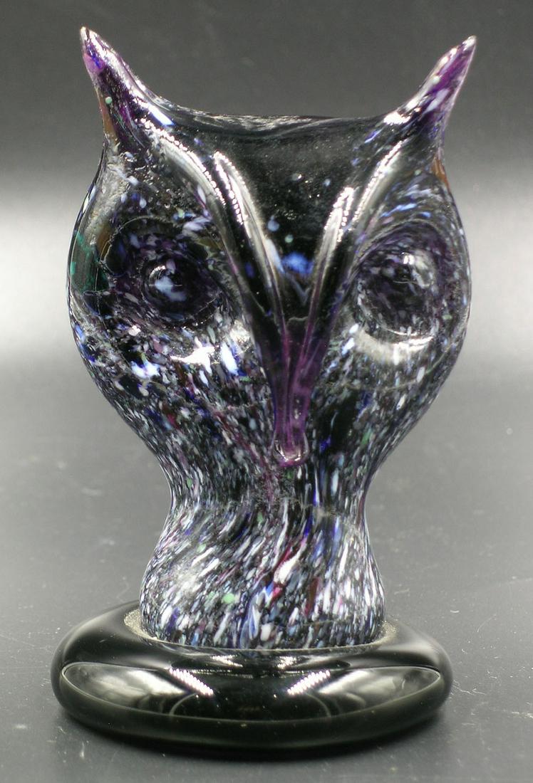 BRYDEN PAIRPOINT GLASS ENAMELWARE PAPERWEIGHT: deep amethyst with polychrome cane and frit rolled on decoration, in the form of an owl face, 4 1/8" high