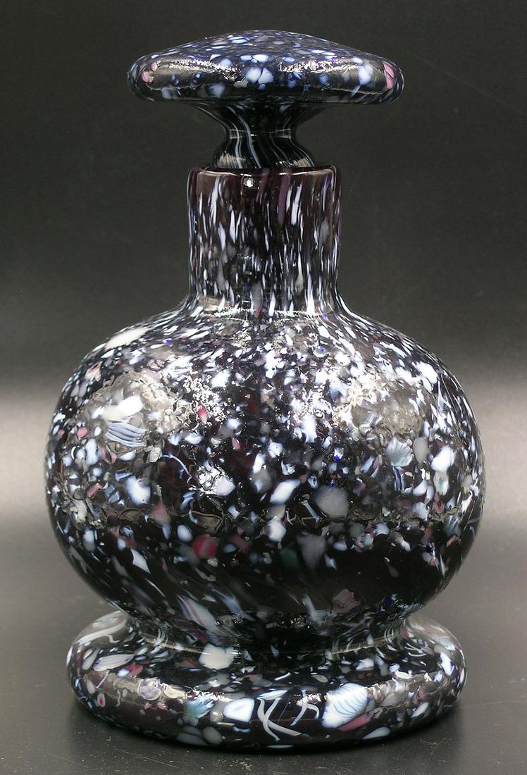 BRYDEN PAIRPOINT GLASS ENAMELWARE BOTTLE WITH STOPPER: deep ruby with polychrome cane and frit rolled-on decoration, bulbous form, mushroom form ground stopper, 4" dia. body, 6 1/4" high.