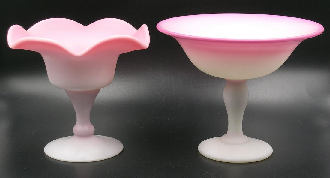 TWO PAIRPOINT PEACHBLOW GLASS FOOTED CANDY DISHES: one having a ruffled rim, 5 1/4" dia., 5" high, and one round, 6 1/4" dia., 5" high. Provenance: Both formerly from the F. and P. Rindge Collection