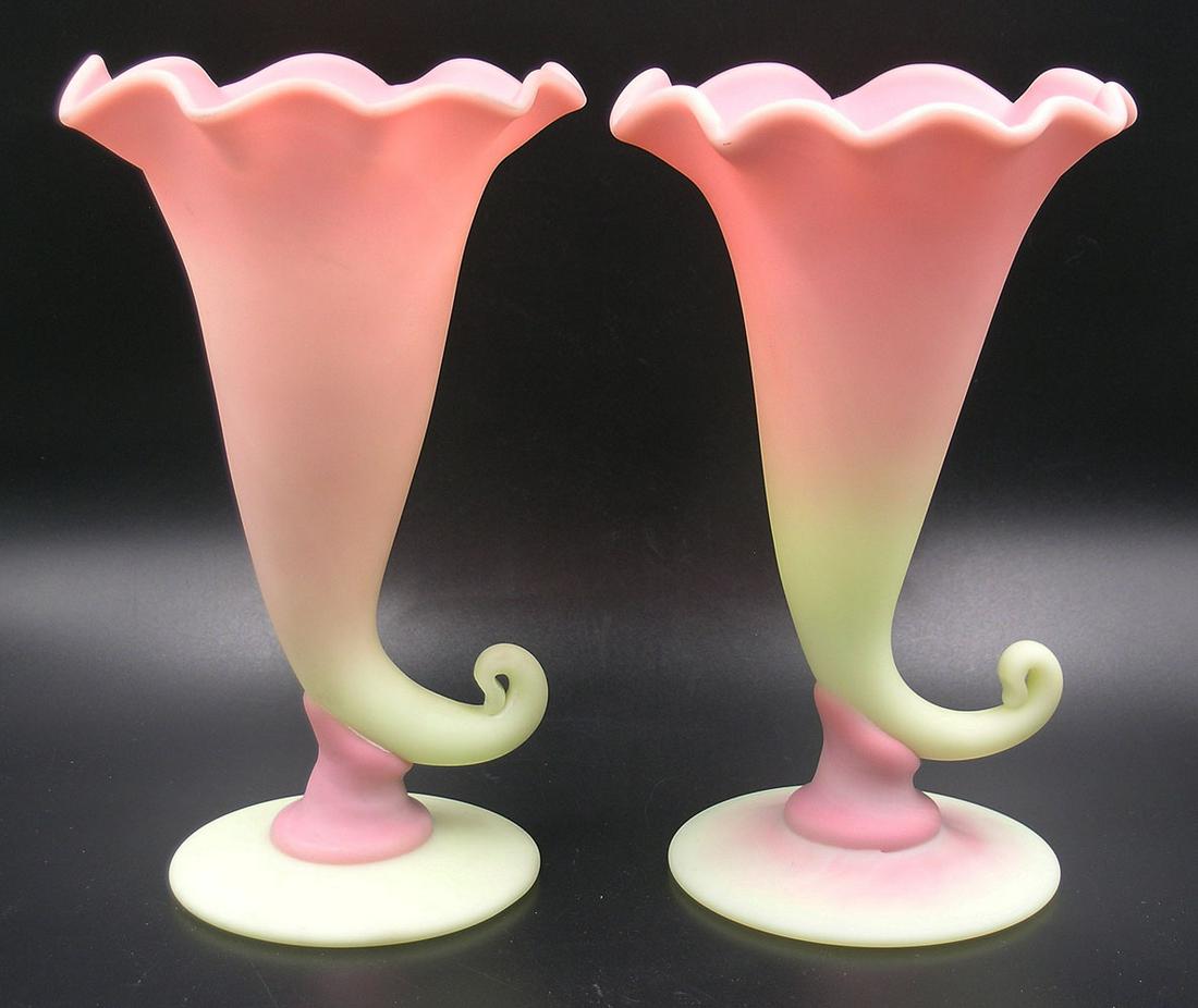 MT. WASHINGTON BURMESE GLASS CORNUCOPIA VASES: matte finish, 7" high, unfinished pontils Provenance: Both formerly from the F. and P. Rindge Collection