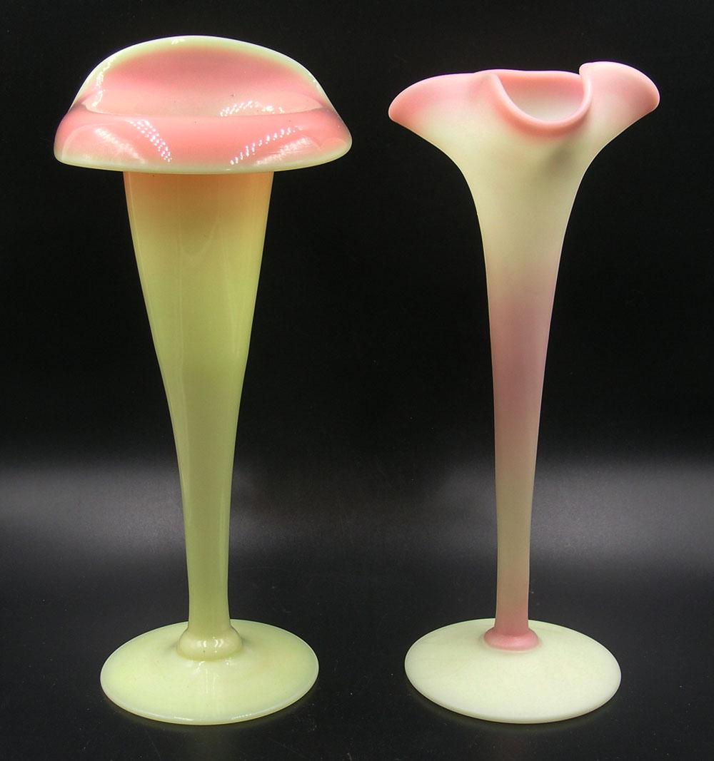 TWO PAIRPOINT BURMESE GLASS VASES: one being a Lily vase, matte finish, unfinished pontil, 9" high and one being a Jack-In-The-Pulpit, gloss finish, smooth pontil, 9 1/4" high Provenance: Both formerly from the F. and P. Rindge Collect