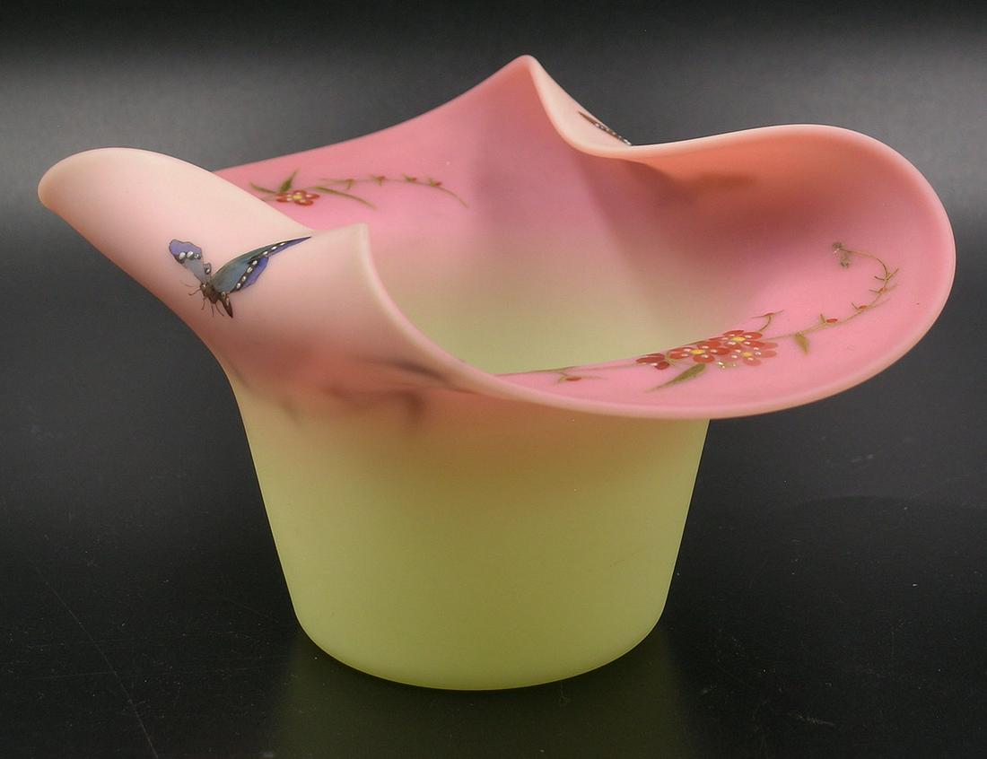MT. WASHINGTON BURMESE GLASS HAT VASE: brim folded in, having hand decorated butterflies on the outside of each side of the brim, floral and leaf decoration on the inside, , polished pontil, 5 1/2" long, 3 3/4" wide, 3" high