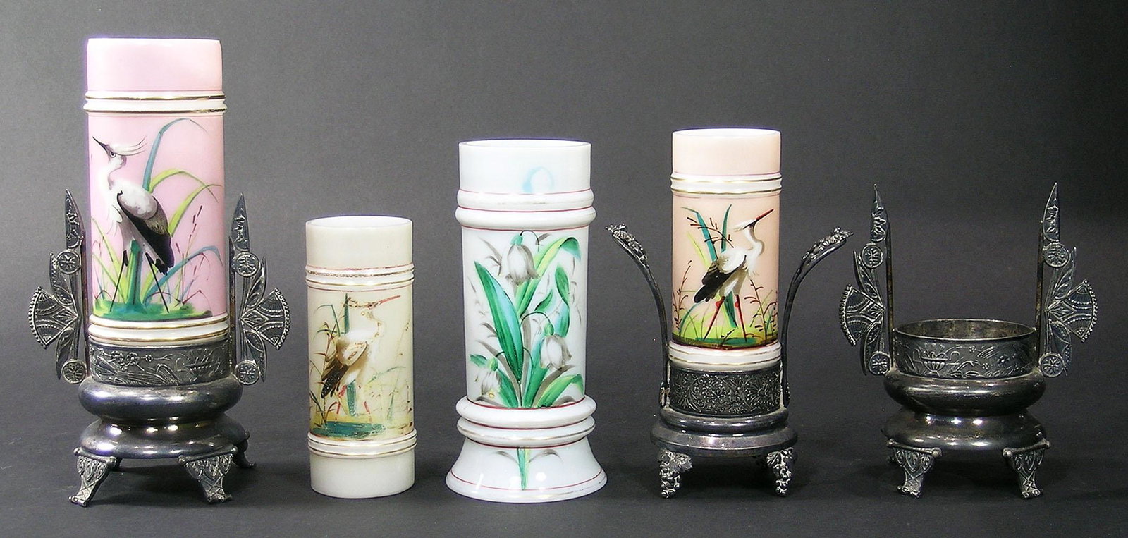 FOUR SMITH BROTHERS DECORATED OPAL RING GLASS VASES: all having hand painted decoration, comprising three depicting various Herons, and one having Lily Of The Valley decoration, two being fitted into a quadruple-plate stand, also having a separate quadr