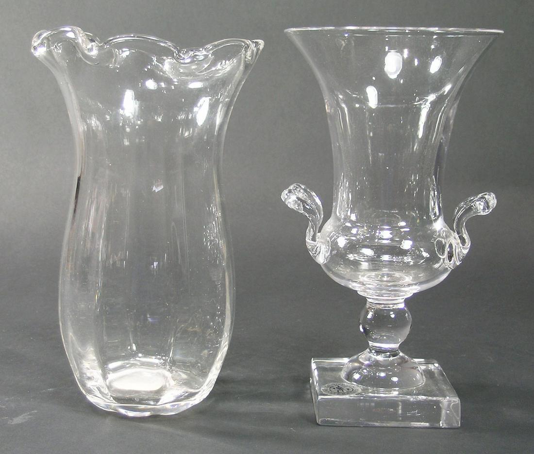 TWO GUNDERSEN MASTERPIECE GLASS VASES: colorless glass, comprising a medium urn form vase, 8 5/8" high, and one having an optic ribbed body with a flaring ruffled rim, 8 5/8" high and having a tag stating that these vases were made for Shr