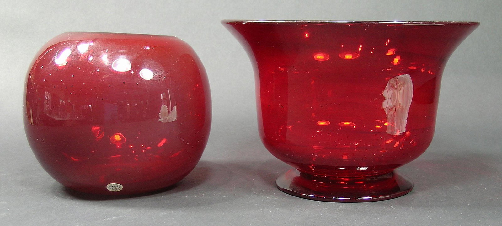 TWO PAIRPOINT RUBY GLASS BOWLS: one footed with flaring rim, finished pontil, 8 1/2" dia., 5 3/4" high, and a Rose bowl, unfinished pontil, 6" dia., 5 1/4" high