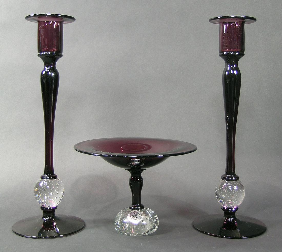 THREE PIECE PAIRPOINT GLASS CONSOLE SET: Amethyst, comprising a Gundersen Masterpiece comport having a colorless glass base with controlled air bubbles, having original silver label, 6 3/4" dia., 5" high, and a pair of candlesticks #B-1627 h
