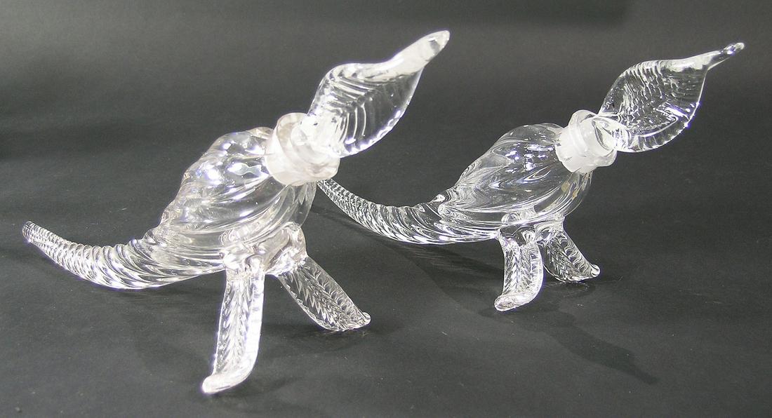 TWO PAIRPOINT GLASS CORNUCOPIA PERFUME BOTTLES: colorless glass, both having leaf form stoppers and legs, both approx. 10" long