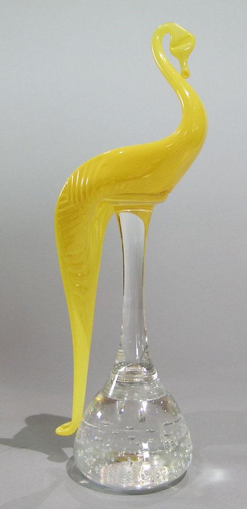 PAIRPOINT ART GLASS SWAN ON A STEM PAPERWEIGHT: yellow glass, on a colorless glass stem, tapering ball form base having entrapped air bubbles, unfinished pontil, 10 3/4" high
