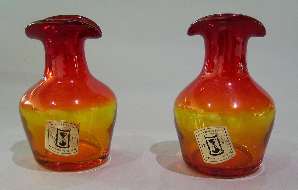 TWO PAIRPOINT HEIRLOOMS AMBERINA CREAMERS: no handles, having a two sided spout, each being 3 7/8" high.
