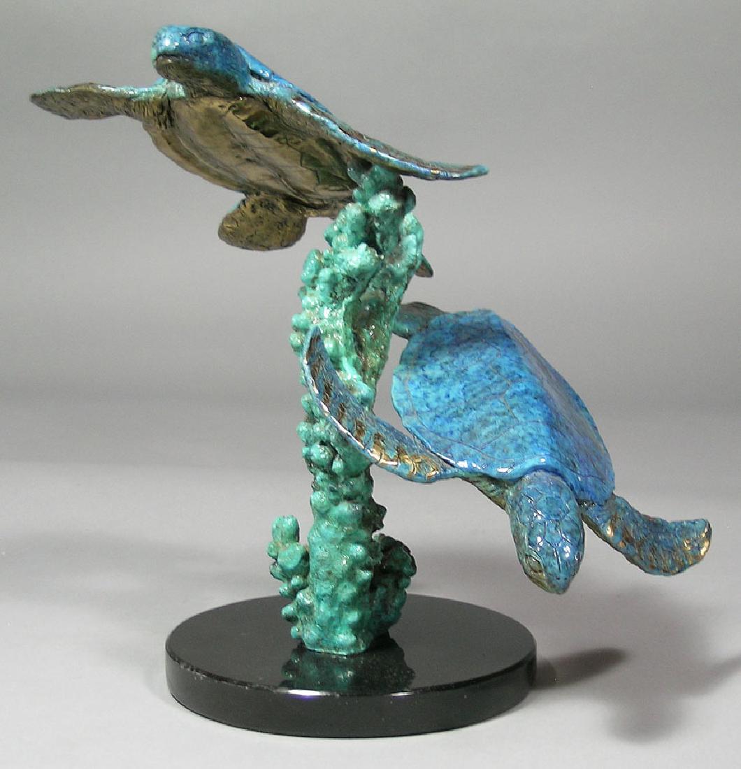 Robert Wyland Bronze, "Green Sea Turtles": Robert Wyland (American, b.1956), circa 1991 patinated bronze sculpture, titled "Green Sea Turtles", edition 37/300, 11" high, raised on a circular black marble base. Accompanied by a certificate from