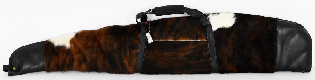 Cowhide Rifle Case - Chocolate NEW 52" Leather Han: Cowhide Rifle Case with zipper Outside Measurements: 52" X 10" Inside Measurements: 50.5" X 9" Made from Colombian Cowhide Leather on each end of Rifle Case with leather handle Pocket with Zipper on o