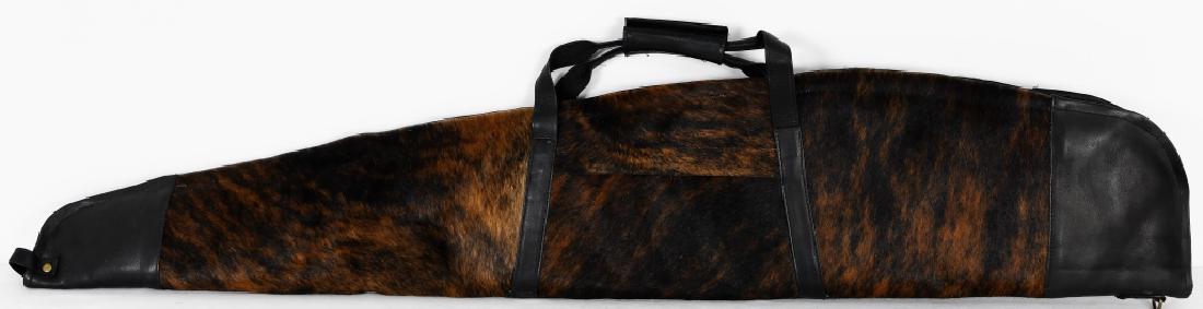 Cowhide Rifle / Shotgun Case - Brindle 52" NEW: Cowhide Rifle Case with zipper Outside Measurements: 52" X 10" Inside Measurements: 50.5" X 9" Made from Colombian Cowhide Leather on each end of Rifle Case with leather handle Pocket with Zipper on o