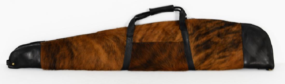 Cowhide Rifle Case - Brindle: Cowhide Rifle Case with zipper Outside Measurements: 52" X 10" Inside Measurements: 50.5" X 9" Made from Colombian Cowhide Leather on each end of Rifle Case with leather handle Pocket with Zipper on o