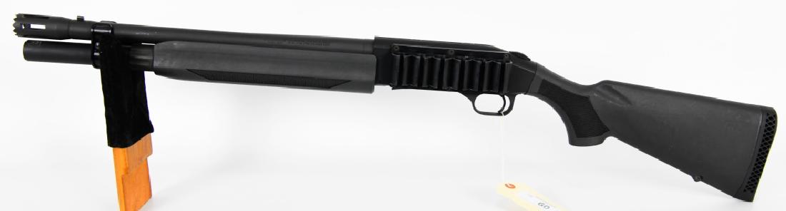 Mossburg Model 930 Tactical 12 Gauge Shotgun: Here is the ultimate home defense shotgun, This Mossberg appears in excellent like new condition, it has been fitted with a door breaching choke, large cocking bar, synthetic stock, and chambered in 1