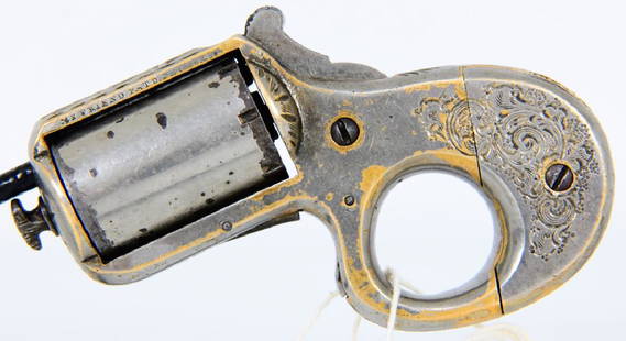 RARE Engraved James Reid "My Friend" KnuckleDuster: Up next is a seldom seen, Engraved James Reid "My Friend" Knuckle-Duster chambered in .22 Caliber. This numbers matching, engraved James Reid .22 caliber, combination "Kunckleduster" revolver is a way