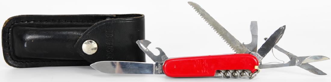 Swiss Army Knife Officer W/ Buck Sheath: Here we have an Officer Swiss Army Knife in good pre-owned condition, missing tweezers, comes in a Leather Buck 110 Case