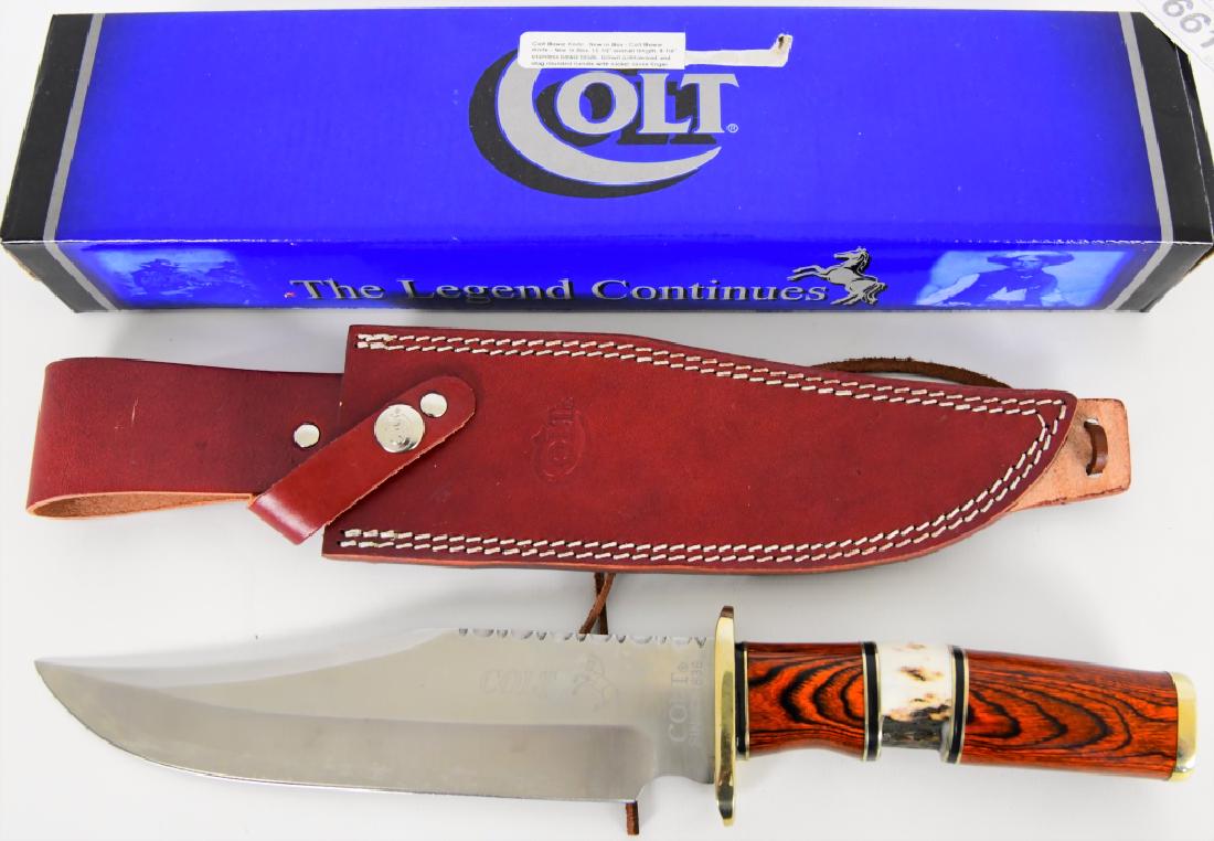 COLT Bowie Knife new in box 13.5" Overall: Here is a New in the box COLT Bowie Knife "The Legend Continues" overall length of Knife is 13.5" 8.25" stainless bowie blade, brown pakkawood and stag rounded handle with nickel silver finger