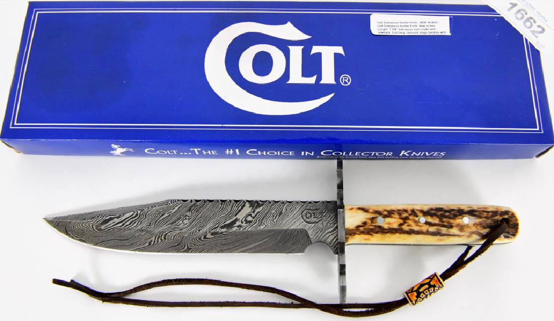 COLT Damascus Hunter Knife NEW in box: Colt Damascus Hunter Knife new in the box, Length is 7 5/8" damascus steel blade with sawback. Full tang, genuine stage handles NO sheath COLT #1 choice in collector Knives , The Legend Continues