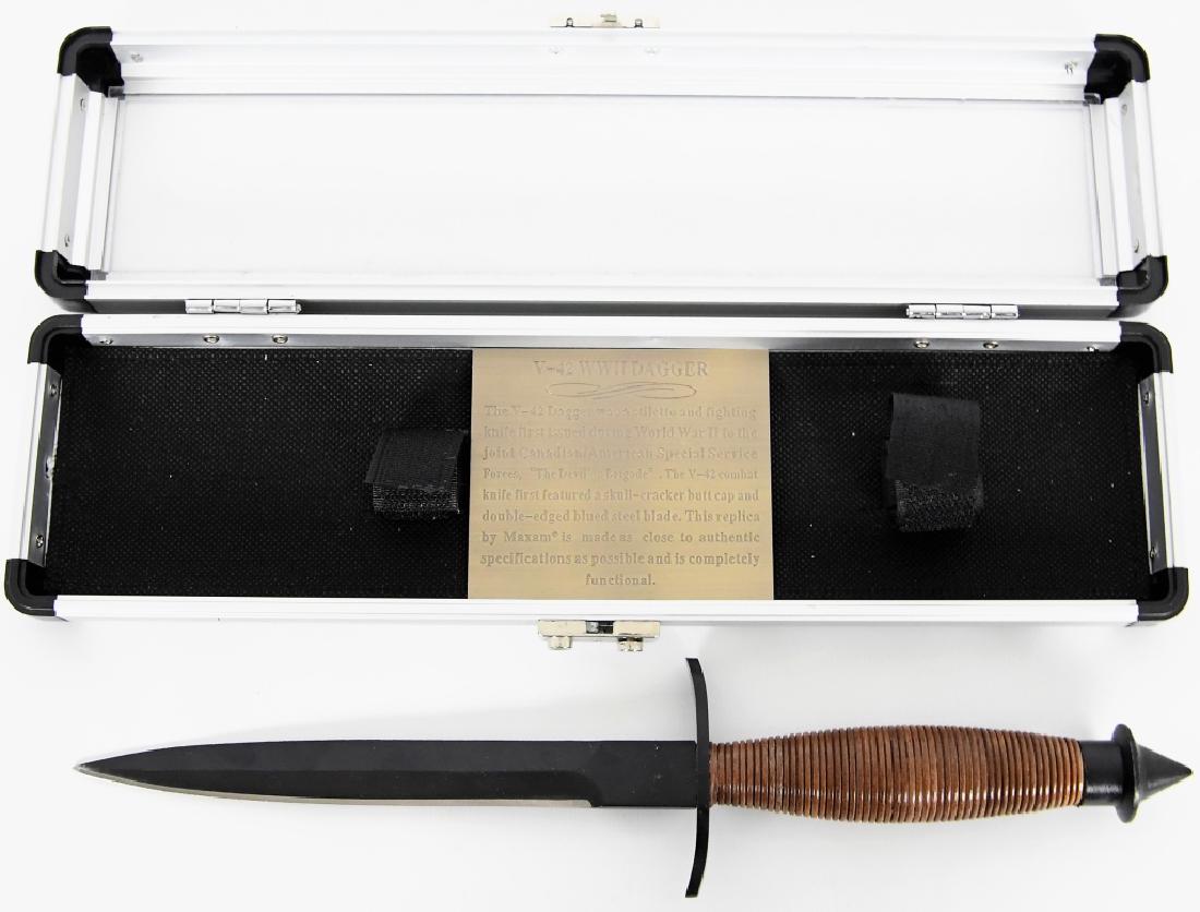 Maxam Commemorative V-42 WWII 12-1/2" Dagger: Here we have a V-42 WWII Dagger replica in a nice presentation case, excellent condition. Features laminated wood handle with a stainless steel non-glare blade. Measures 12-1/2 overall. Aluminum stora
