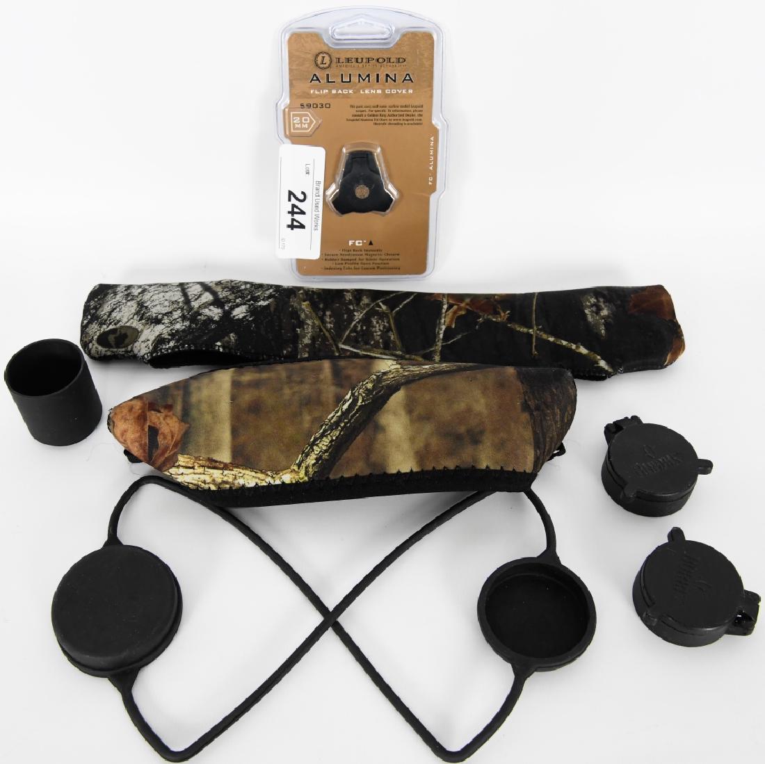 Lot of scope accessories: Here w have a lot of scope goodies, I see Leupold Alumina flip back lens cover, 1 1/2" extended sun shade, 1 piece rubber lens cover, 2 camo neoprene quick pull scope covers, and 2 burris quick flip s